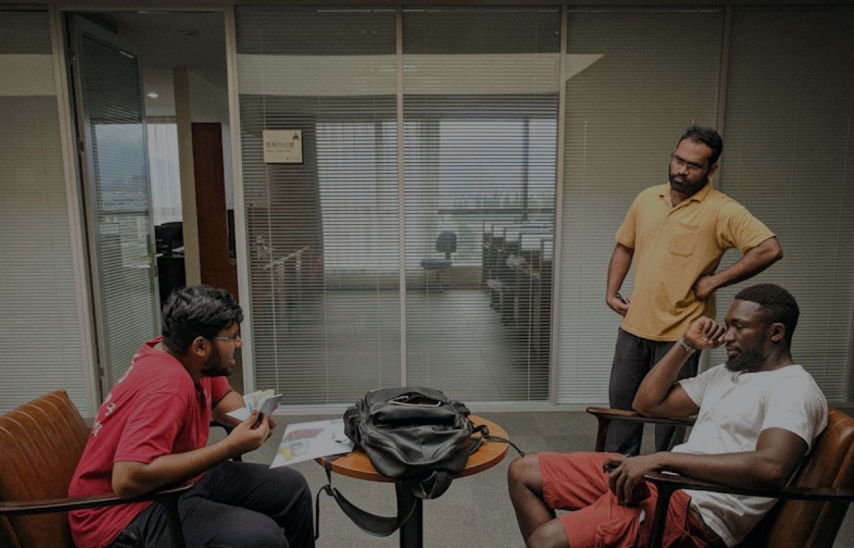 Mediators in conversation around a table in an office